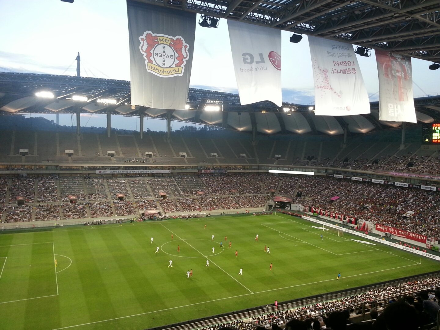 K League football match under floodlights in a full Seoul stadium