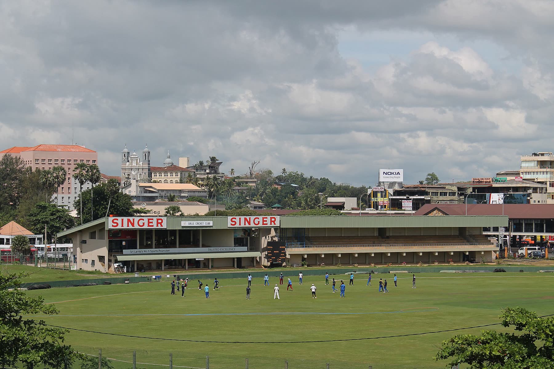 Cricketers batting during a match in Sri Lanka