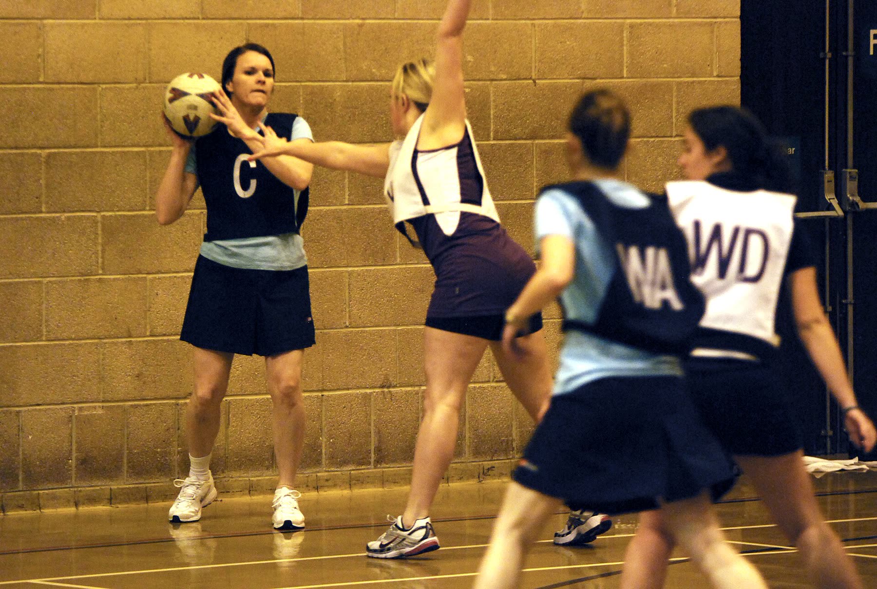 Netball match in play on an outdoor court